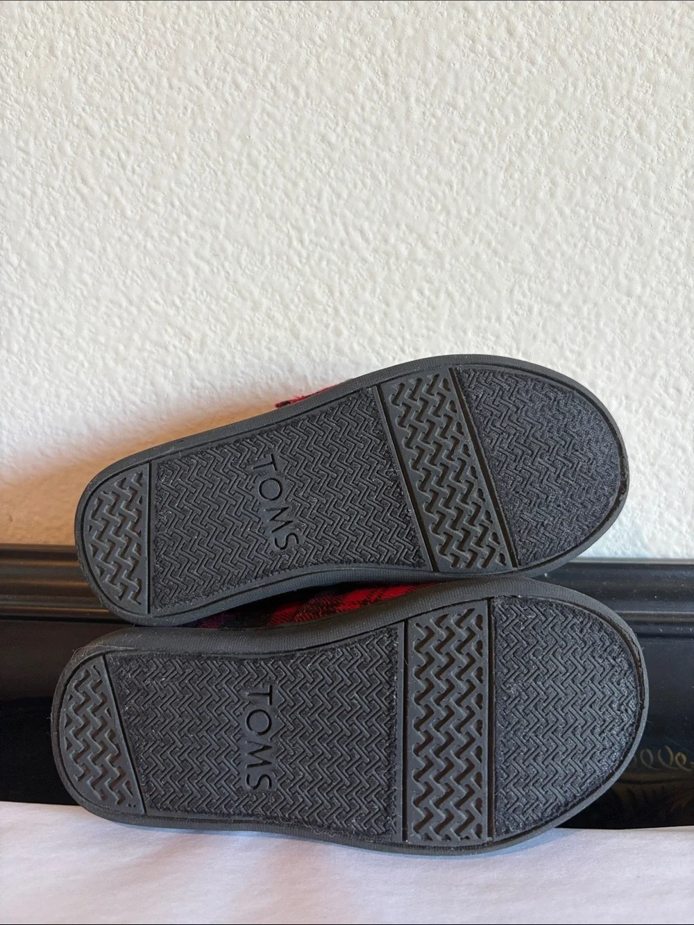 TOMS Black and Red Plaid Slip on shoes